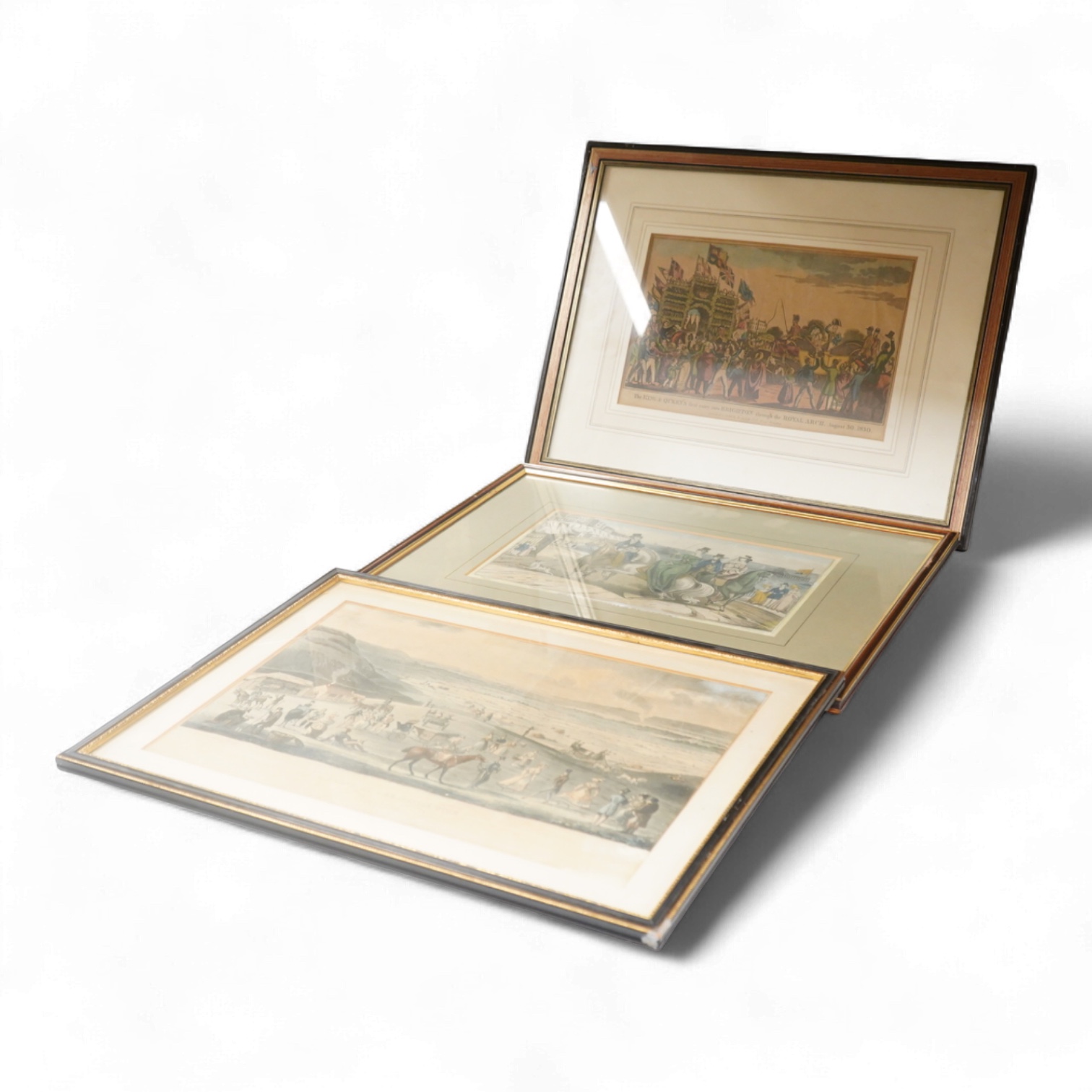 Three Brighton interest prints, 19th century, to include: The King and Queen's first entry into Brighton through the Royal Arch, 1830, published and sold by W Belch at Brighton, largest 27 x 39cm